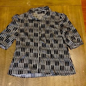 This is a woman's blouse. It is a size extra-large and is black and white.